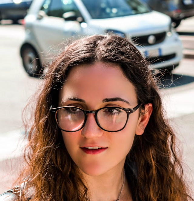 Woman wearing glasses street portrait.